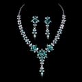 Macro detail of bridal jewelry set with green crystal flowers and silver pear drops - Green Rhinestone Silver Plated