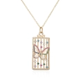 Macro shot of 18K gold plated necklace featuring a detailed butterfly cage pendant - Hollow Butterfly Shape