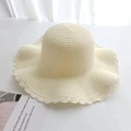 Close-up of cream straw sun hat featuring elegant scalloped edges and woven fiber texture - Kids / Plain Style / Cream