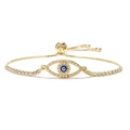 Verstellbares goldenes Evil Eye Armband mit weißen Zirkonia und blauem Zentrum - Gold Rundes Auge
