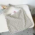 Detail of beige canvas tote bag with black polka dots on a minimalist white desk - Beige Polka Dot