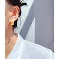 Lava texture gold plated brass hoop earring worn on ear with organic molten metal design - Gold