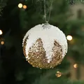 Boule de Noël de 8cm en mousse avec paillettes dorées, effet neige et ficelle argentée - 8cm/7g / Doré