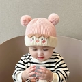 Pink and beige knit baby hat with twin pom-poms and cute cartoon facial embroidery - Kids Blush Face - Pink