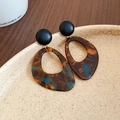 Macro view of geometric teardrop earrings in acrylic tortoise shell on a ceramic plate - 34# Silver Earring Post-Dark Coffee (Tortoise Waterdrop)