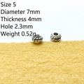 Detailed view of 7mm silver spacer beads with twisted texture and 2.3mm hole for DIY jewelry - 5#
