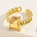 Macro shot of gold-plated chain ring featuring a square plate with clover zircon inlay - Square Zirconia Ring / Gold