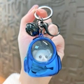 Portachiavi zaino blu con animale dei cartoni animati bianco, campanellino e anello nero - Zaino Luminoso - Blu