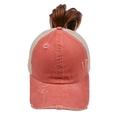 Close-up of coral pink distressed mesh trucker hat with integrated brown ponytail - One Size / Orange