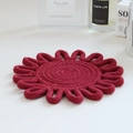 Detailed close-up of a handmade dark red floral cotton rope woven table mat - Wine Red