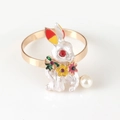 Golden metal napkin ring with white enamel rabbit, colorful flowers, and pearl tail - 3-White Enamel Flower Bunny with Pearl Tail