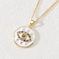Macro detail of golden evil eye pendant with colorful zircon stones on white leather - Style L-Triangle Decor Colorful Eye