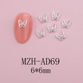Detailed silver hollow butterfly nail charm with mini diamond on pink nail surface - Silver Hollow Rhinestone Butterfly (AD69)