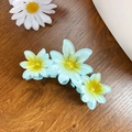 Light blue flower claw clip with yellow center on wooden surface for elegant hair styling - Green 11CM