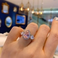 Macro shot of elegant pear-cut pink diamond ring with sparkling halo and silver band - Pink Zirconia Ring 8X12