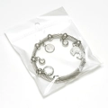 Bracciale in filo d'acciaio argento con ciondolo delfino e perle di cristallo trasparente - Color Acciaio