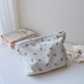 Detail of floral embroidery and white textured dots on cotton makeup bag with zipper - Cut-flower Red Floral White Base