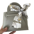 Elegant grey faux leather wedding gift bag featuring a decorative printed floral scarf - Gray