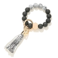 Detail of matte black and marble silicone bead keychain with wooden bead and tassel - Black Snake Pattern