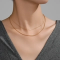 Layered PVD plated gold stainless steel necklace with bead and snake chain worn by model - Gold Mini Bead & Dragon Chain Layered