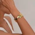 Minimalist wide gold cuff bracelet featuring a unique twisted design for a bold fashion look - Twisted Mirror Gold Cuff (SL241) / Gold