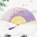 Classic purple folding fan with cherry blossom pattern and purple silk tassel detail - Cherry Blossom Rain - Purple