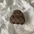 Close-up of a brown matte hair claw clip with a quilted pattern on a white paper background - Small / Dark Coffee