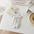 Beige crew socks with heart embroidery and colorful nep yarn dots on a minimal desk - One Size / White