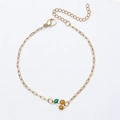 Detail van de 18K vergulde armband met kersenhanger en verstelbare karabijnsluiting - Armband / Goud + Geel