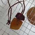 Detail of bohemian geometric resin pendant with deep red and amber marble texture - Brown & Yellow Combination