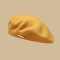 British style ginger yellow wool beret featuring a signature gold metal plaque - One Size / Yellow
