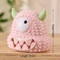 Pink monster squeaky dog toy with green horns and raised textures, size 10x9cm - Monster Style / Pink