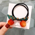Détail d'un élastique cerise avec nœud à pois et double cordelette élastique - Élastique Cerise / Orange
