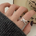 Minimalist sterling silver infinity ring in silver finish worn on finger for casual style - JZ1390 (Infinity Symbol)
