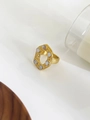 Macro shot of 18K gold irregular hollow ring set with white mother of pearl inlay - US 7 / Gold