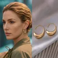 Gold Polished Crescent Moon Shaped Simple Earrings