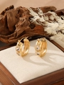 Macro detail of gold-plated earrings with clear zircon stones on a rustic wooden base - ZHE986 Style - White Rhinestone / 18K Gold