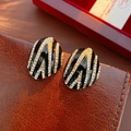 Macro detail of vintage oval earrings with black enamel, gold stripes and rhinestones - 41# Silver Pin-Gold-Black