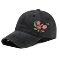 Close-up of pink flower embroidery on a washed black cotton baseball cap for women - One Size / Black (Flower Pattern)