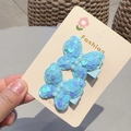 Pair of bright blue sequin butterfly hair clips with pearl details on display card - Blue Duckbill Clip (Pair)