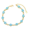 Detail of Hamsa Hand and Evil Eye gold bracelet with blue enamel and crystal accents - Blue
