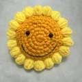 Handmade crochet sunflower pendant with cute smiling face and vibrant yellow petals - Smiley Sunflower 10cm
