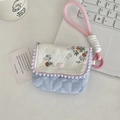 Detail of floral and blue striped cotton mini storage bag with pink heart button - Floral Orange + Blue Stripes
