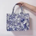 Blue and white canvas tote bag featuring tropical forest animals and palm tree prints - Basic Style / Blue Floral Print