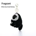 Llavero de peluche mono saki de cara blanca con pelaje negro y clip metálico dorado - Dudu Mono Saki de Cara Blanca