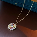 Dettaglio ravvicinato della collana placcata in oro con ciondolo a fiore colorato - Collana-Multicolore