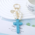 Blue rhinestone cross keychain with white pearls and gold lobster clasp for bags - Lake Blue