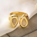 Detailed close-up of double pear-shaped gold ring with pave zircon on white silk background - Adjustable Open / Gold Pear-shaped Waterdrop Style (14120)