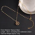 Gold plated titanium steel spinning clover necklace with sparkling cubic zirconia - Circular Hollow Clover Style (A844)