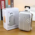 Mini silberne Koffer-Spieluhr mit Teleskopgriff und funktionalen Rollrädern - Silber